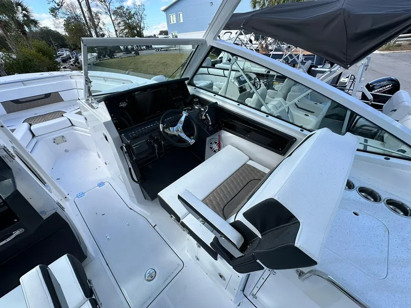 Slide: The Image of 2024 Blackfin 272 DC boat interior with helm station and seating. - 7