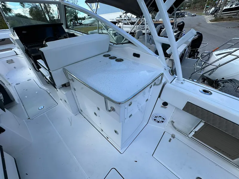 Slide: The Image of 2024 Blackfin 272 DC boat interior with seating and storage compartments. - 9