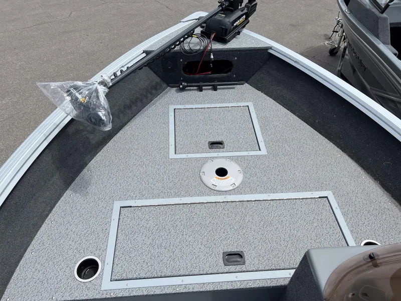 Slide: The Image of 2023 Starcraft Stealth 166 DC boat deck with storage compartments and trolling motor. - 11