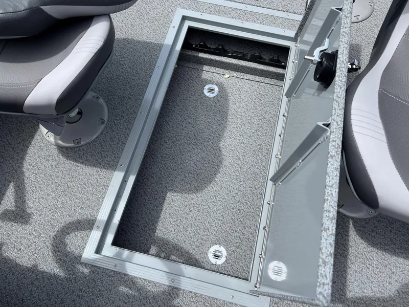 Slide: The Image of Open storage compartment on a 2023 Starcraft Stealth 166 DC boat. - 18