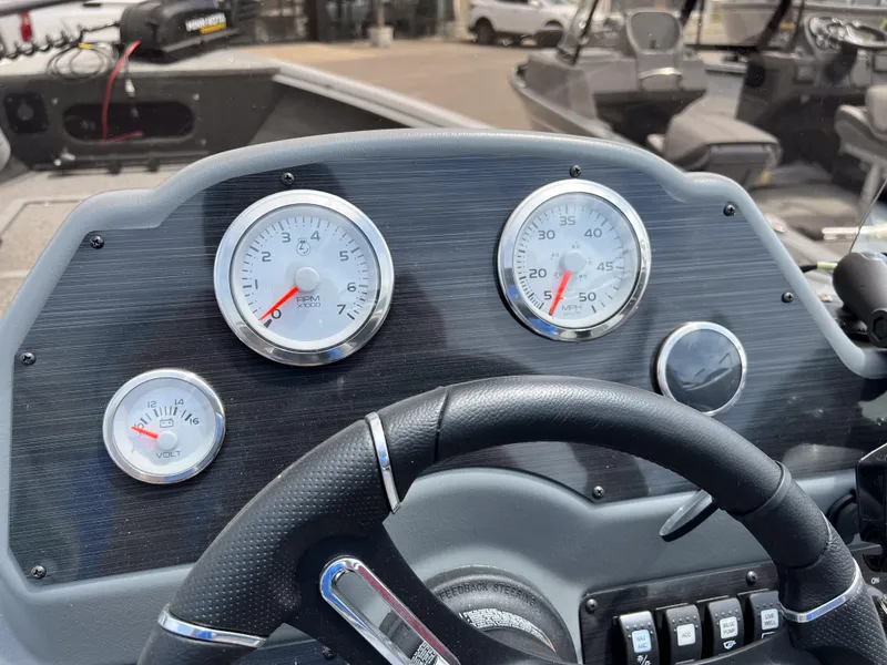 Slide: The Image of Dashboard of 2023 Starcraft Stealth 166 DC boat with gauges and steering wheel. - 20