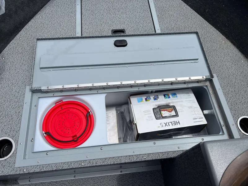 Slide: The Image of Storage compartment of a 2023 Starcraft Stealth 166 DC boat with a Helix 5 fish finder. - 21