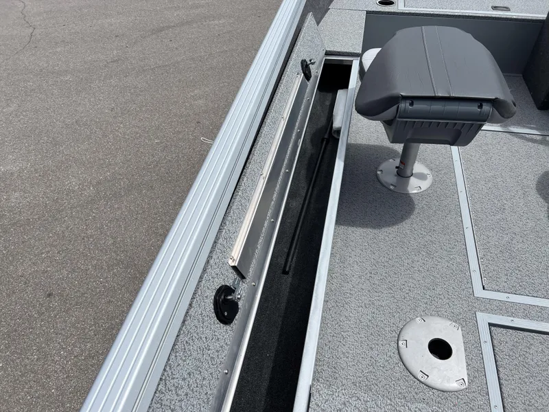Slide: The Image of 2023 Starcraft Stealth 166 DC boat interior with seating and storage compartments. - 5