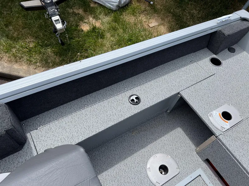 Slide: The Image of Interior view of 2023 Starcraft Stealth 166 DC fishing boat with gray seating and deck. - 6