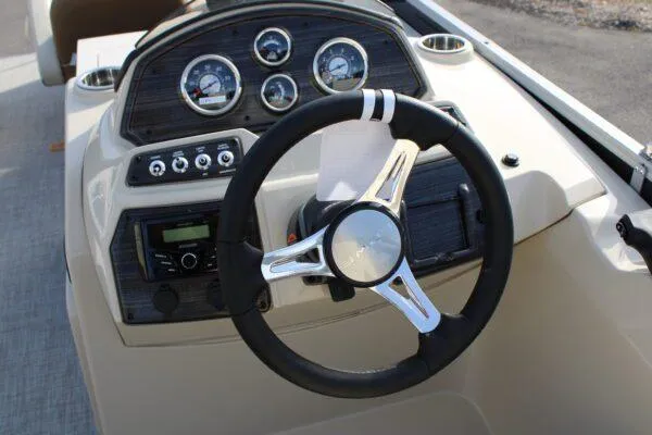 Slide: The Image of 2023 Lowe SF212 boat dashboard with steering wheel and instrument panel. - 6