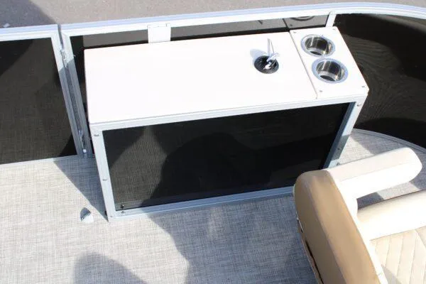 Slide: The Image of 2023 Lowe SF212 boat interior with a built-in console and cup holders. - 9