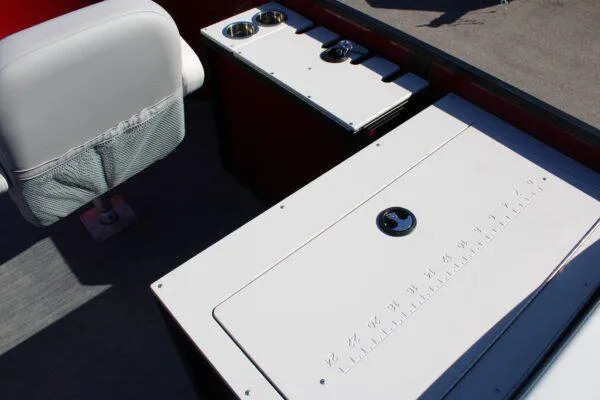 Slide: The Image of 2023 Lowe SF214 Sport Fish boat interior with seating and storage compartments. - 10