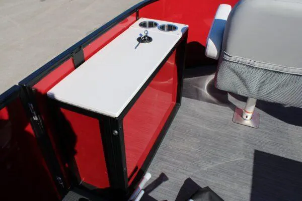 Slide: The Image of 2023 Lowe SF214 Sport Fish boat interior with red paneling and cup holders. - 11