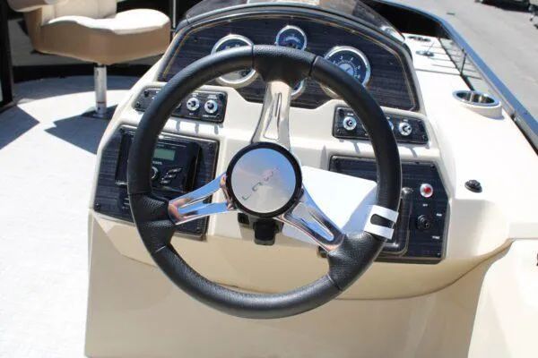 Slide: The Image of Steering console of 2023 Lowe SF214 Sport Fish boat with modern controls and gauges. - 10