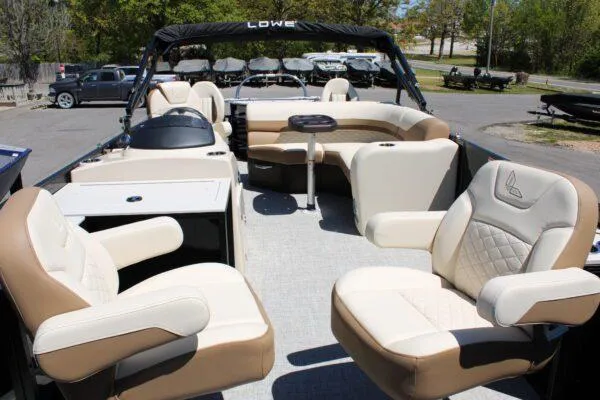 Slide: The Image of 2023 Lowe SF214 Sport Fish boat with beige and white seating. - 14