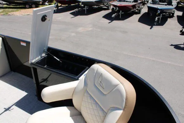 Slide: The Image of 2023 Lowe SF214 Sport Fish boat with open storage compartment and cushioned seat. - 3