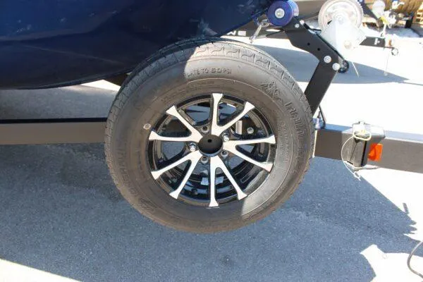 Slide: The Image of 2023 Lowe ST178 boat trailer wheel and tire close-up. - 3