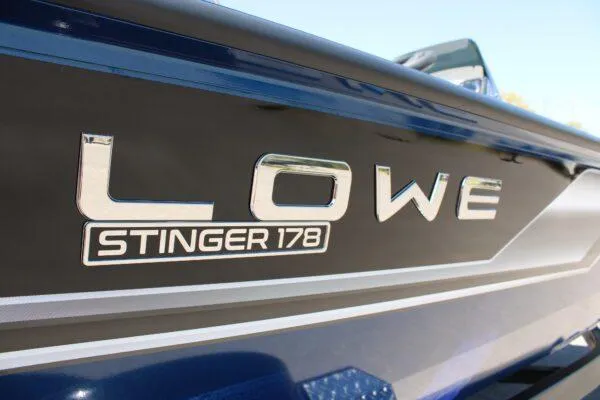 Slide: The Image of 2023 Lowe ST178 Stinger boat side view with logo. - 4