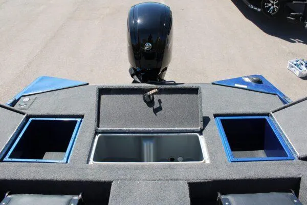 Slide: The Image of 2023 Lowe ST178 boat with open storage compartments and motor. - 9
