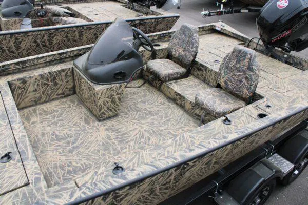 Slide: The Image of 2023 Lowe CAT 20 boat with camouflage design and dual seating. - 5