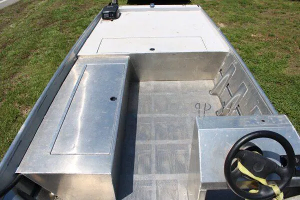 Slide: The Image of 2020 Blazer 1752 aluminum fishing boat interior with steering wheel and storage compartments. - 4