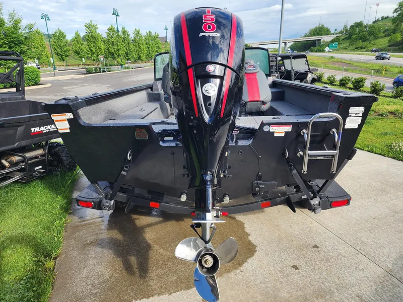 Slide: The Image of 2023 Ranger VS1882SC Angler boat with powerful outboard motor, parked outdoors. - 3