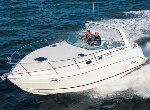 The Image of 2003 Rinker 290 Fiesta Vee cruising on open water. - 1