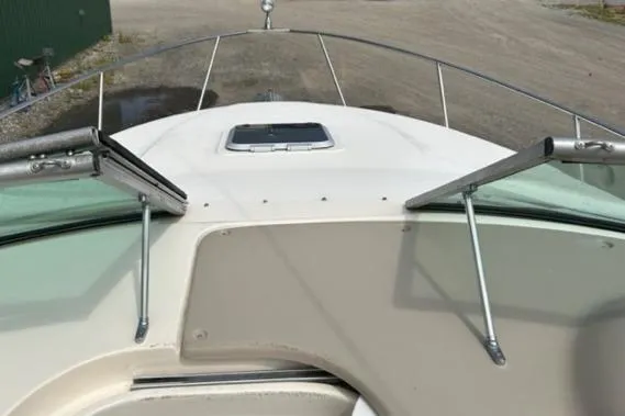 Slide: The Image of 2003 Rinker 290 FIESTA VEE boat deck with open windshield and hatch. - 13