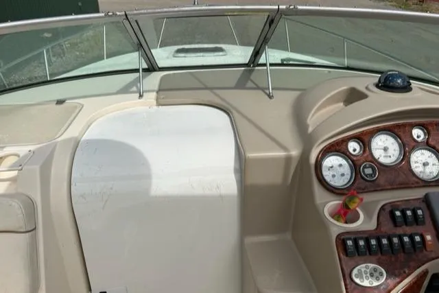 Slide: The Image of 2003 Rinker 290 FIESTA VEE boat dashboard with gauges and controls. - 14