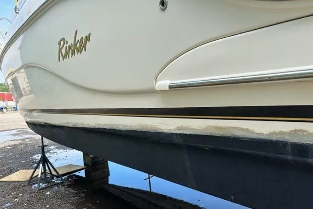 Slide: The Image of 2003 Rinker 290 Fiesta Vee boat on stands, side view. - 24