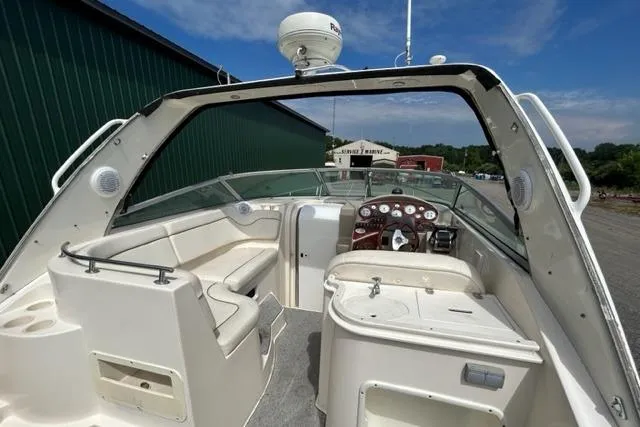 Slide: The Image of 2003 Rinker 290 FIESTA VEE boat interior with seating and control panel. - 6