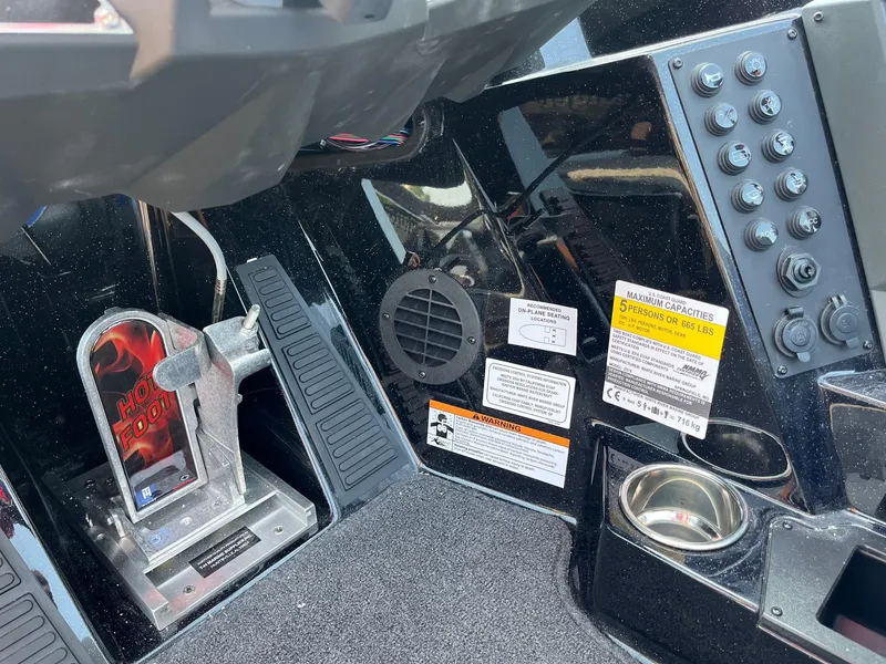 Slide: The Image of 2024 Ranger Z519 boat cockpit controls and foot pedals. - 10