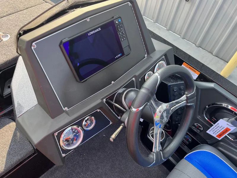 Slide: The Image of 2024 Ranger Z519 boat dashboard with Lowrance HDS display and steering wheel. - 11
