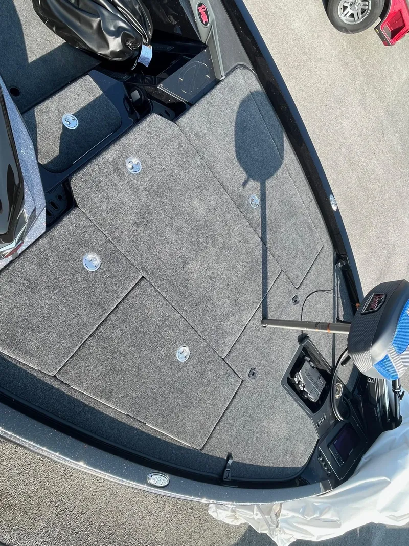 Slide: The Image of 2024 Ranger Z519 boat deck with storage compartments and fishing seat. - 5