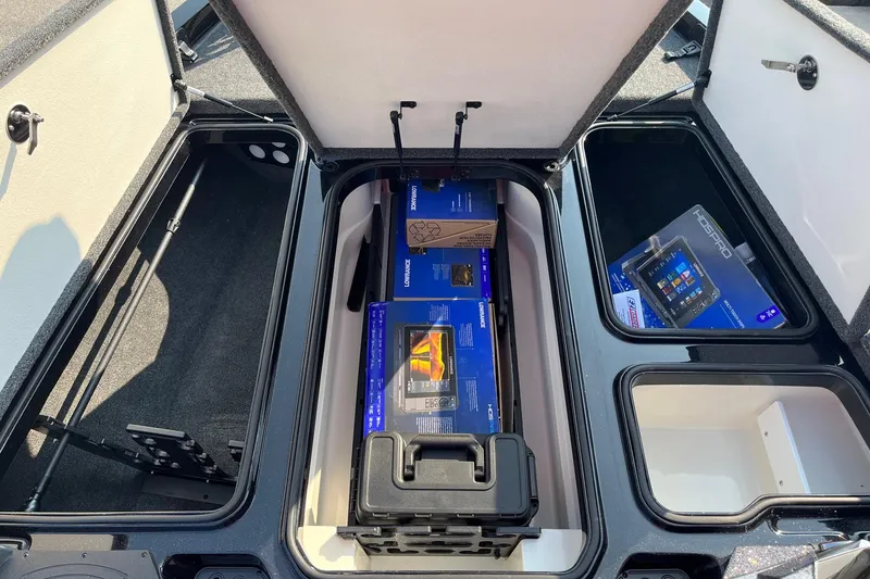 Slide: The Image of 2024 Ranger Z519 storage compartments with fishing gear and electronics. - 6