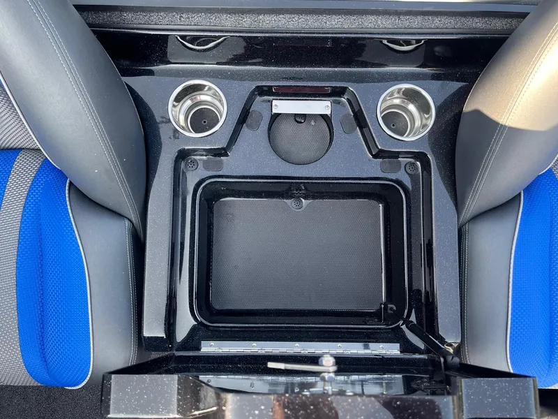Slide: The Image of 2024 Ranger Z519 boat console with cup holders and storage compartment. - 9