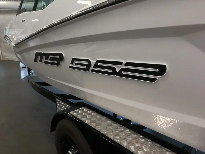 Slide: The Image of 2023 MB B52 Alpha boat side view with model name. - 3