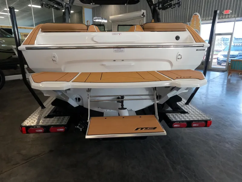 Slide: The Image of 2023 MB B52 Alpha boat rear view in showroom. - 7