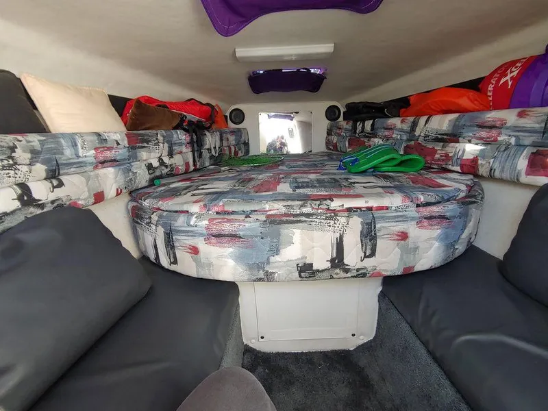 Slide: The Image of Interior cabin of a 1999 Baha Cruisers 290 Mach 1 boat with colorful seating. - 14