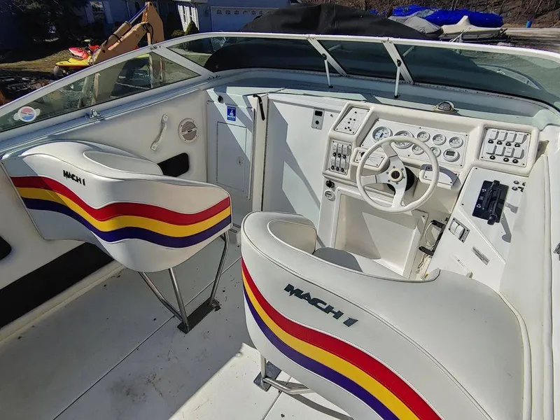 Slide: The Image of 1999 Baha Cruisers 290 Mach 1 boat cockpit with colorful seats and control panel. - 15