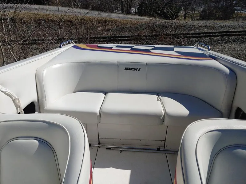 Slide: The Image of 1999 Baha Cruisers 290 Mach 1 boat interior with white seating. - 16