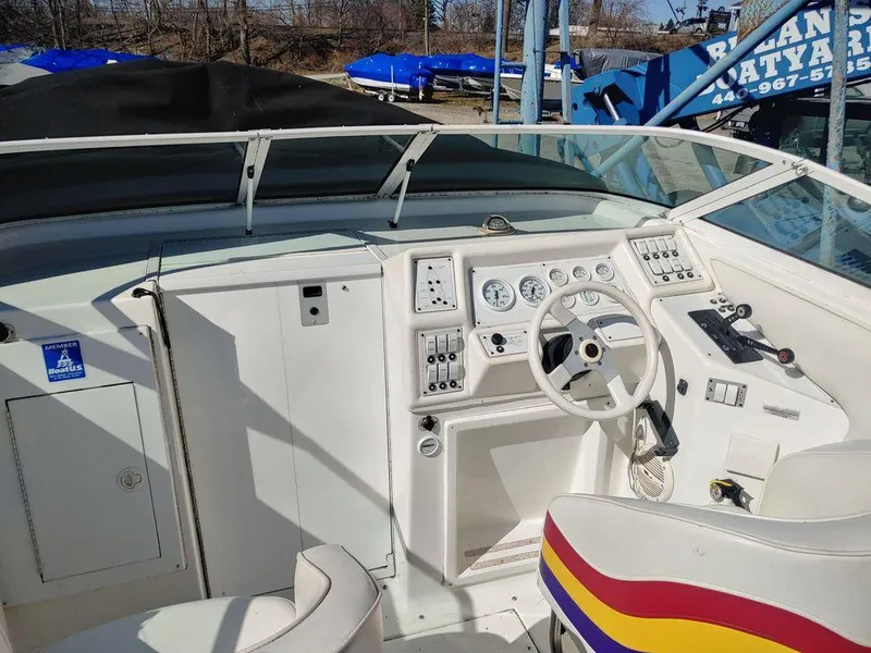 Slide: The Image of 1999 Baha Cruisers 290 Mach 1 boat cockpit with steering wheel and control panel. - 17