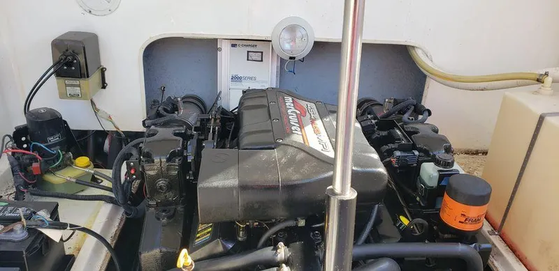 Slide: The Image of 1999 Baha Cruisers 290 Mach 1 engine compartment with MerCruiser engine. - 9