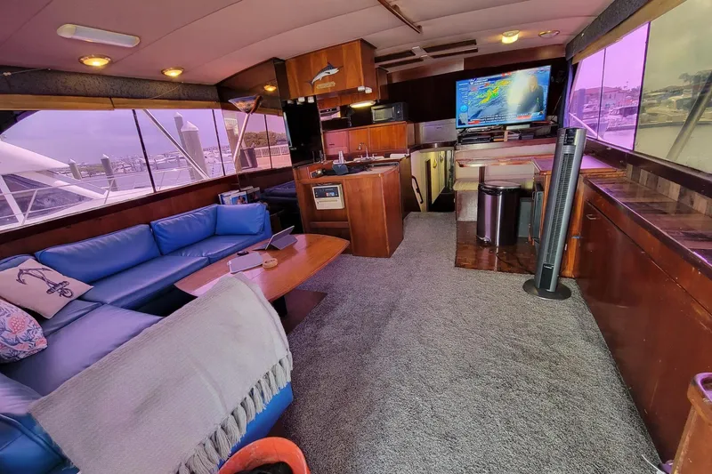 Slide: The Image of Interior of 1985 Ocean Yachts 55 Super Sport with blue seating and modern amenities. - 18