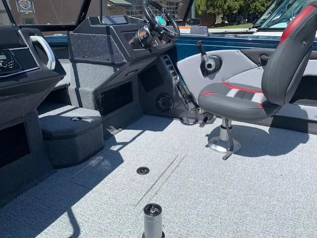 Slide: The Image of 2023 Ranger VX1788 WT boat interior with steering console and seating. - 3