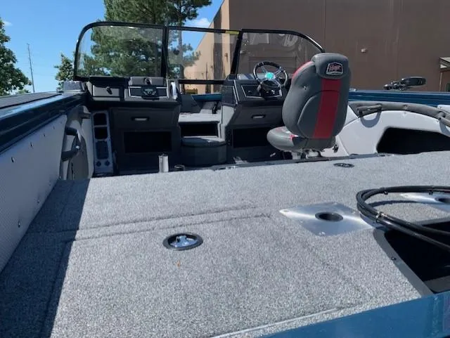 Slide: The Image of 2023 Ranger VX1788 WT boat interior with steering console and seating. - 4