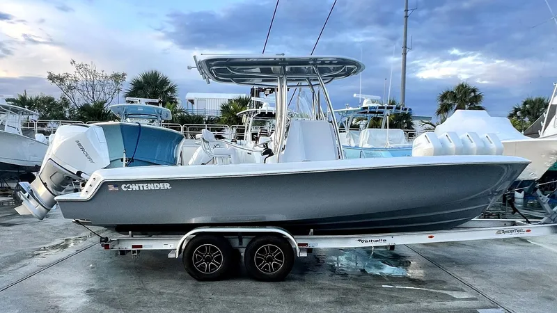 Slide: The Image of 2024 Contender 24S boat on trailer at marina. - 0