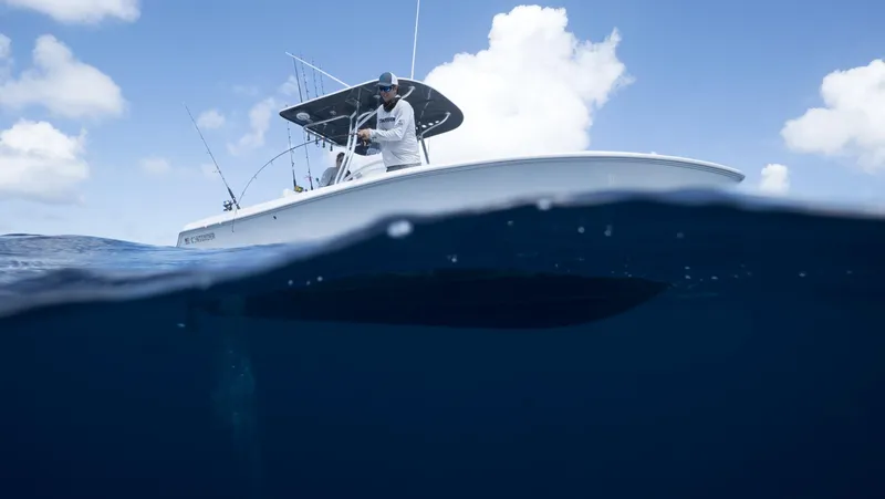 Slide: The Image of 2024 Contender 24S boat on the ocean, half-submerged view. - 5