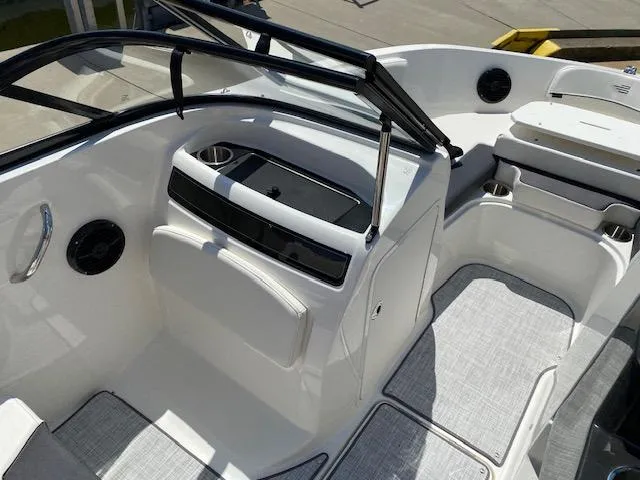 Slide: The Image of 2024 Bayliner VR5 boat interior with seating and storage compartments. - 11