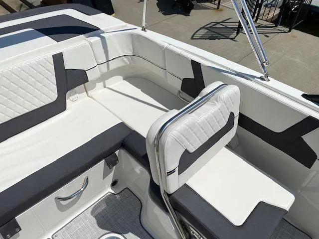 Slide: The Image of 2024 Bayliner VR5 boat interior with white and gray seating. - 13