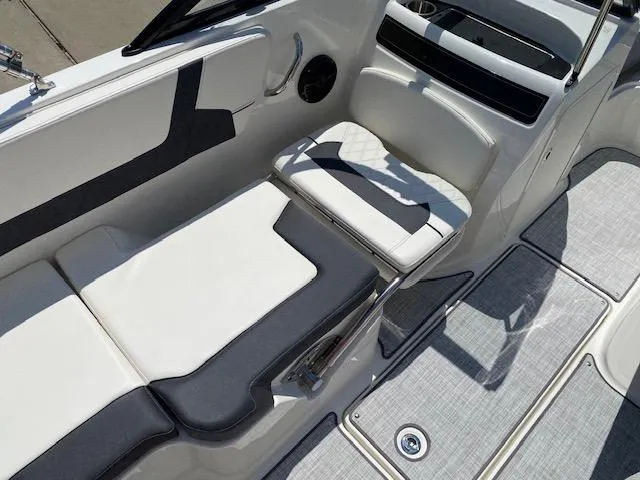 Slide: The Image of 2024 Bayliner VR5 boat interior with white and gray seating and modern design. - 16
