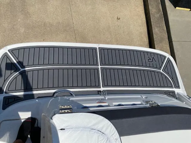 Slide: The Image of 2024 Bayliner VR5 boat deck with sleek gray padding. - 21