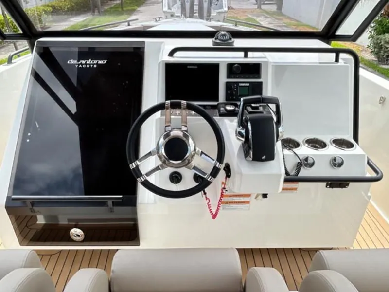 Slide: The Image of 2024 De Antonio Yachts D28 Xplorer helm with modern controls and steering wheel. - 11