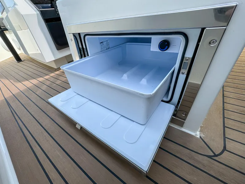 Slide: The Image of Open storage compartment on 2024 De Antonio Yachts D28 Xplorer, featuring sleek design and functionality. - 24