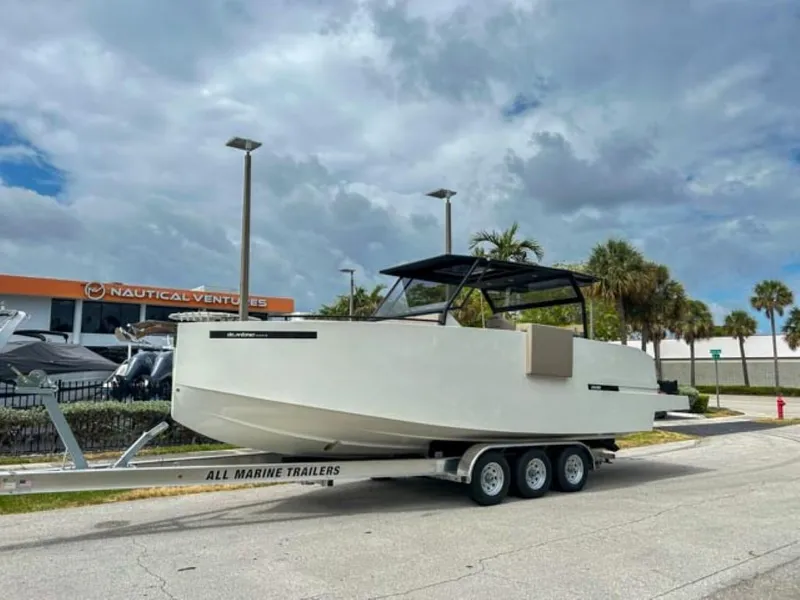 Slide: The Image of 2024 De Antonio Yachts D28 Xplorer on trailer at Nautical Ventures dealership. - 28